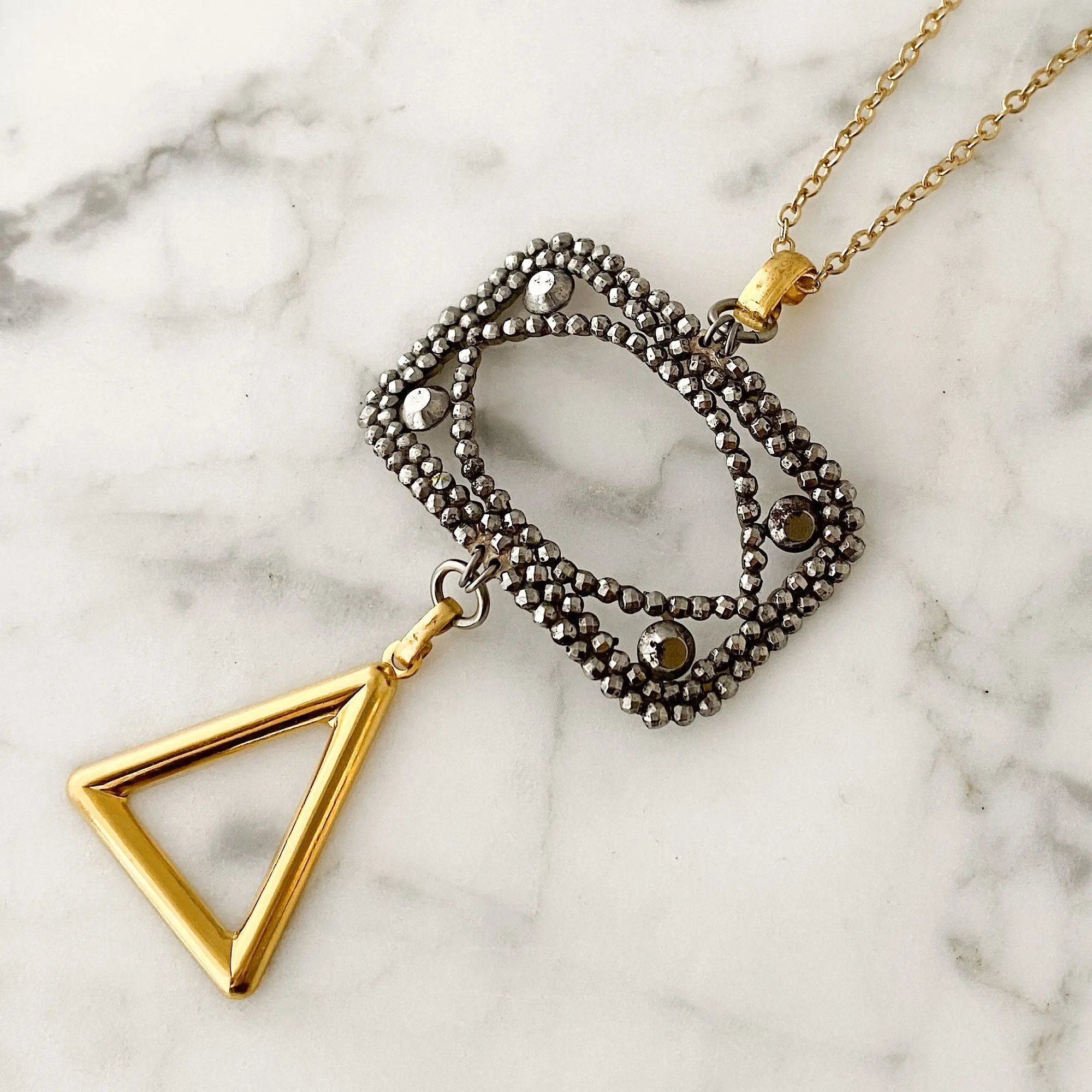 LAKOTA steel buckle and gold triangle necklace